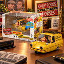Close-up view of Sporting Profiles musical yellow three wheeled van featuring Del Boy and Rodney novelty bobble figures.
